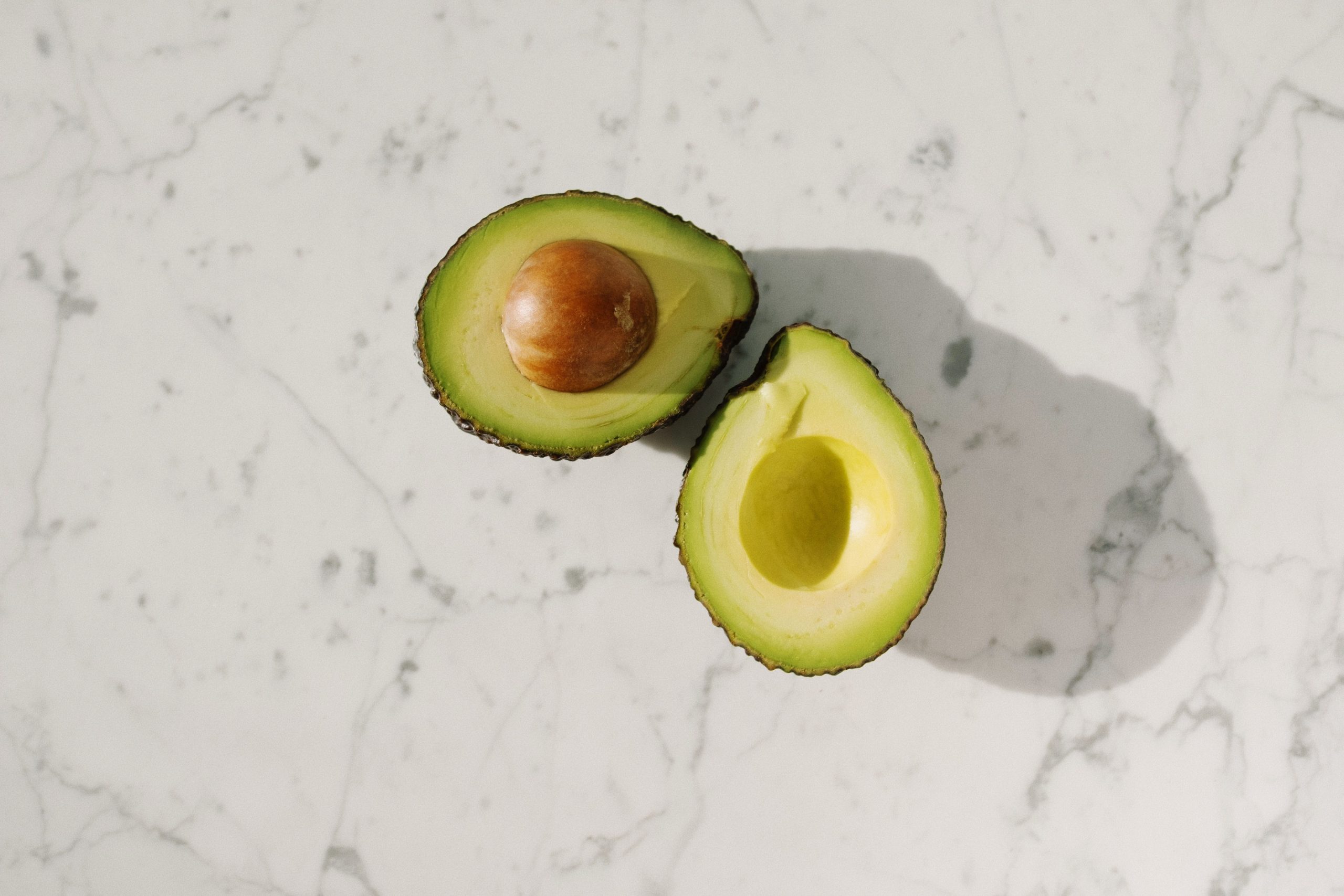 Avocado and chocolate—foods that are toxic to budgies and should never be fed.